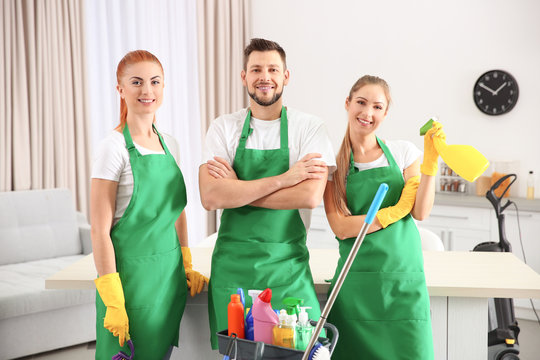 Cleaning service team at work in kitchen