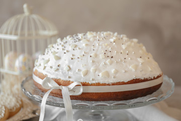 Tasty Easter cake on light background