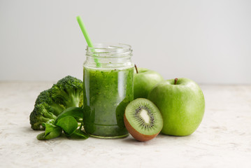 Healthy green smoothie and ingredients
