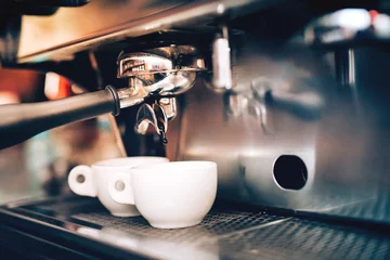 Fototapeten Professional coffee brewing. Espresso machine preparing and pouring two perfect cups of coffee. Restaurant details © aboutmomentsimages