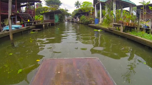 Village on the water. Tourists visiting the Thai market on the water.