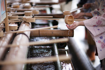 Place the ritual washing of hands before visiting a Shinto shrine - 138363256