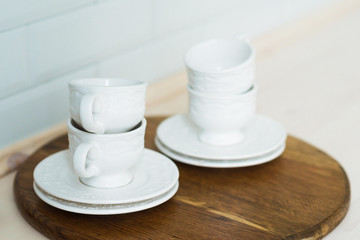 White tea set on a tray, kitchen table