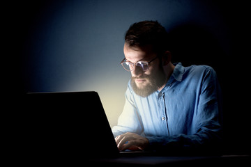 Businessman in the office at night