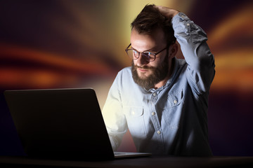 Businessman in the office at night