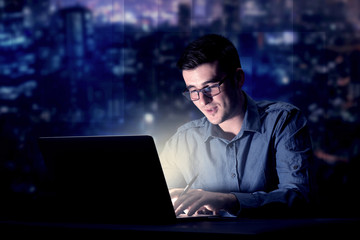 Businessman in the office at night