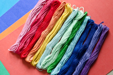 Embroidery floss on a colored background