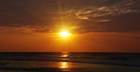Bright sunrise over the ocean.