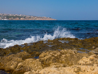 Rethymno, Greece - July  31, 2016: Rocky Mediterranean beach.