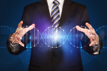 Businessman holding DNA