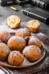 Homemade donuts with sugar and gun