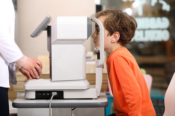 at the optician, Optometrist in exam
