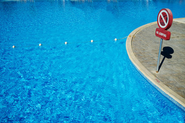 Fototapeta na wymiar Blue water in the swimming pool, safety buoys