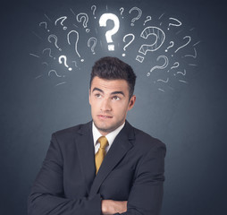 Businessman with question marks