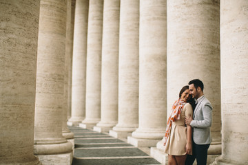 Loving couple at the St. Peter's Square in Vatican