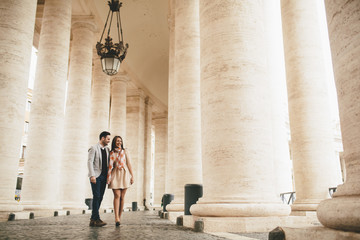 Fototapeta na wymiar Loving couple at the St. Peter's Square in Vatican