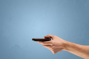 Holding telephone device from profile