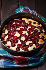 Homemade cherry pie on rustic background