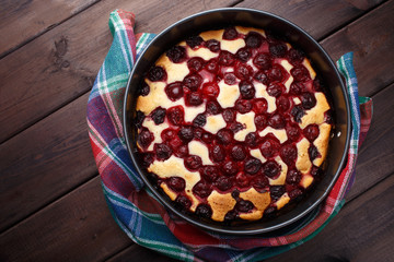 Homemade cherry pie on rustic background