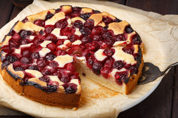 Homemade cherry pie on rustic background