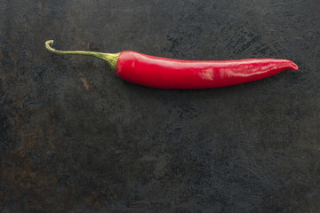 cayenne chilli pepper on rusty metal background