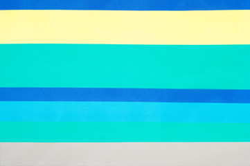 Fabric silk texture, striped pattern. yellow blue blue steel strips