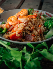 Vintage style Thai traditional food fried rice with shrimp on top and wooden background wallpaper