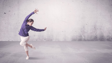 Pretty urban dancer with empty background