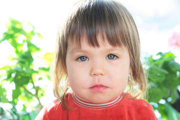 Child portrait with neutral face,Caucasian little girl unemotional face