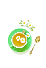 Chamomile tea in cup isolated on white background.