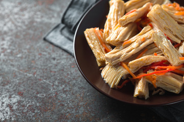 Appetizer Asparagus in Korean in a ceramic plate copy space