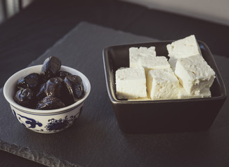 Pieces of cheese and olives
