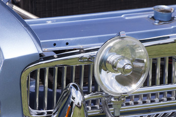 Front Grill of a Vintage Blue Car