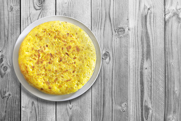 Traditional spanish omelette on wooden table