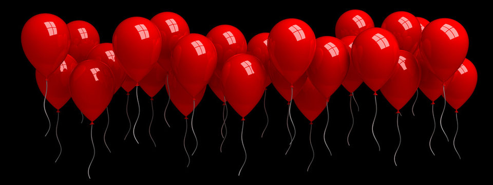 Row of red balloons isolated on black
