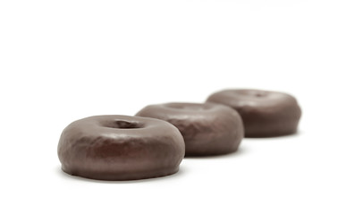 Obraz na płótnie Canvas Chocolate donuts isolated on a white background