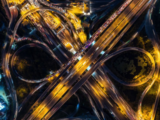 The light on the road  roundabout at night and the city in Bangkok, Thailand.Aerial view.Top view.Light scenic road.