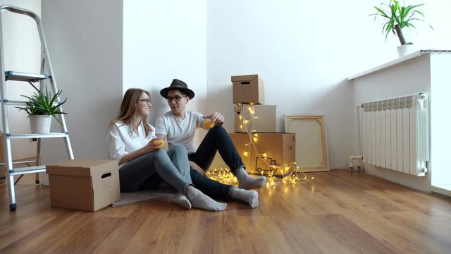Young happy couple moving in new house