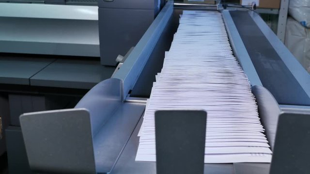 Big row of envelopes on the assembly line in a factory