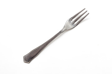 Old metal fork isolated on a white background.