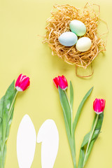 Easter concept on yellow background top view mockup