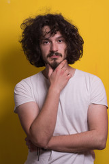 young man with funny hair over color background