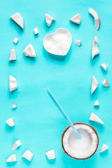 concept organic cosmetics with coconut on blue background top view