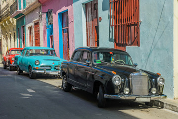 Vintage classic american cars parked in a street of Old Havana,Cuba.