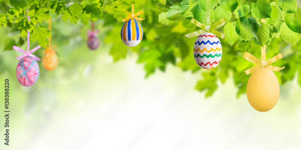 Wall mural Easter Eggs in Green Branches