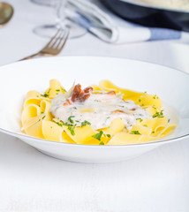 Pasta with cream sauce with chanterelle