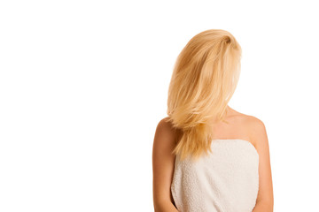 Fototapeta premium Beautiful blonde woman wrapped in towel after bath isolated over white background