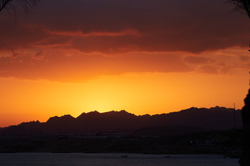 sunset sea and mountains