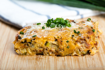 Vegetables casserole with cheese and chives