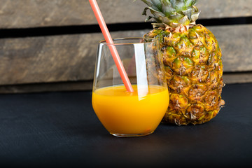 Fresh pineapple and glass with pineapple juice